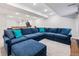 Finished basement featuring a large sectional sofa with accent pillows and recessed lighting at 3962 Hoyt Ct, Wheat Ridge, CO 80033