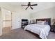 Bedroom featuring a neutral color scheme, large window, ceiling fan, and a dedicated workstation at 3962 Hoyt Ct, Wheat Ridge, CO 80033