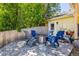 Backyard patio with fire pit, and multiple chairs, great for entertaining and relaxing at 3962 Hoyt Ct, Wheat Ridge, CO 80033