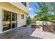 Outdoor patio with stone tile, patio furniture, and mature shade trees at 3962 Hoyt Ct, Wheat Ridge, CO 80033