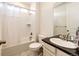 Clean bathroom with shower-tub combo, neutral tile, and a modern vanity at 24505 E Ada Pl, Aurora, CO 80018