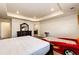 Bedroom featuring neutral carpet, tray ceiling, with a car bed, a desk and furniture at 24505 E Ada Pl, Aurora, CO 80018