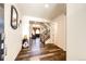 Warm foyer featuring beautiful hardwood floors, staircase, and contemporary decor at 24505 E Ada Pl, Aurora, CO 80018