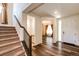 Inviting foyer with hardwood floors, staircase, and ample natural light at 24505 E Ada Pl, Aurora, CO 80018