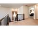 Upstairs hallway with views of the bedroom and staircase, showcasing the layout at 24505 E Ada Pl, Aurora, CO 80018