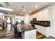 Gourmet kitchen features a large island, stainless steel appliances, and pendant lighting at 24505 E Ada Pl, Aurora, CO 80018