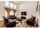 Spacious living room with high ceilings, hardwood floors, and comfortable seating at 24505 E Ada Pl, Aurora, CO 80018