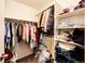 Organized walk-in closet with shelving and hanging rods for ample storage space at 24505 E Ada Pl, Aurora, CO 80018