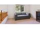 Bedroom showcasing a comfortable sofa, neutral walls, carpet flooring and a bright window at 10795 Quail Creek E Dr, Parker, CO 80138