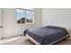 Cozy bedroom with carpet flooring and a window showing the neighborhood at 10795 Quail Creek E Dr, Parker, CO 80138