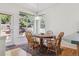 Cozy breakfast nook featuring wood floors and views of the landscaped backyard at 10795 Quail Creek E Dr, Parker, CO 80138