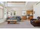 Open-concept living area with a view of the kitchen and ample natural light at 10795 Quail Creek E Dr, Parker, CO 80138