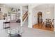 Bright, open-concept living area with soaring ceilings and large windows at 10795 Quail Creek E Dr, Parker, CO 80138