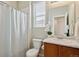 Bathroom featuring a shower with tile surround and a vanity with ample counter space at 1635 S Andes Way, Aurora, CO 80017