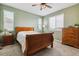 This bedroom features neutral carpet, a ceiling fan and ample natural light from three windows at 1635 S Andes Way, Aurora, CO 80017