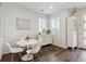 Cozy breakfast nook with a round table, four chairs, and a storage cabinet at 1635 S Andes Way, Aurora, CO 80017