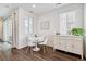 Bright dining area features a round table, modern chairs, and stylish sideboard for a cozy and inviting space at 1635 S Andes Way, Aurora, CO 80017