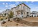 Exterior view of a two-story home with stone accents and well-maintained landscaping at 1635 S Andes Way, Aurora, CO 80017