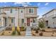 Charming two-story home with a red front door, landscaped yard, and inviting entryway at 1635 S Andes Way, Aurora, CO 80017