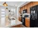 Kitchen island with marble countertop and stainless steel sink, with matching appliances at 1635 S Andes Way, Aurora, CO 80017