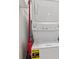 Convenient laundry room with stacked washer and dryer and energy guide at 1635 S Andes Way, Aurora, CO 80017