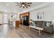 Open-concept living room seamlessly integrates the kitchen, creating a spacious and inviting atmosphere at 1635 S Andes Way, Aurora, CO 80017