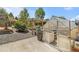 Backyard featuring a garden, a greenhouse, and gravel pathway, perfect for outdoor hobbies and relaxation at 6731 Devinney St, Arvada, CO 80004