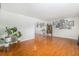 Spacious living room with hardwood floors and ample space for furnishings and decor at 6731 Devinney St, Arvada, CO 80004