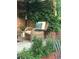Cozy outdoor seating area surrounded by lush greenery, creating a peaceful and inviting space for relaxation at 6731 Devinney St, Arvada, CO 80004