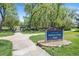 Sign at Ralston Valley Park amidst green trees and pathway perfect for leisure and recreation at 6731 Devinney St, Arvada, CO 80004