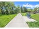 Picturesque walking path with a comfortable bench, perfect for relaxation and enjoying the serene outdoor scenery at 6731 Devinney St, Arvada, CO 80004