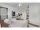 Spacious bedroom with a ceiling fan, large closet, and modern decor, creating a comfortable retreat at 6133 S Sterne Cir, Littleton, CO 80120