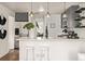 Modern kitchen with sleek countertops, stainless steel appliances, and a stylish breakfast bar for casual dining at 6133 S Sterne Cir, Littleton, CO 80120