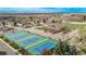 Vibrant tennis courts and surrounding neighborhood offer a picturesque setting and active lifestyle amenities at 6133 S Sterne Cir, Littleton, CO 80120