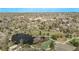 Serene aerial view of a neighborhood park with a lake, trees, and recreation areas under a sunny sky at 6133 S Sterne Cir, Littleton, CO 80120