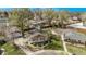 Aerial view of the charming home with well-manicured landscaping and mature trees at 6133 S Sterne Cir, Littleton, CO 80120