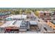 Aerial view of a street featuring local restaurants with outdoor seating, enhancing neighborhood charm and walkability at 6133 S Sterne Cir, Littleton, CO 80120