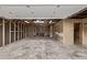 Unfinished garage interior featuring exposed framing and a concrete floor at 6133 S Sterne Cir, Littleton, CO 80120
