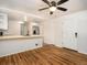 Open-concept living area featuring hardwood floors and a ceiling fan for comfortable and stylish living at 6133 S Sterne Cir, Littleton, CO 80120
