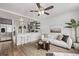 Open-concept living space showcases the updated kitchen, comfortable seating, and modern finishes at 6133 S Sterne Cir, Littleton, CO 80120