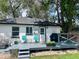 Backyard featuring deck, grill, and seating with a view of the home's exterior at 150 S Osceola St, Denver, CO 80219