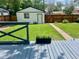 Landscaped backyard with deck, garage, grass and walkway at 150 S Osceola St, Denver, CO 80219