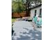 Backyard area with stylish deck, seating, fire pit, and lush landscaping at 150 S Osceola St, Denver, CO 80219