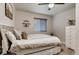 Bright bedroom featuring a decorative headboard, plush pillows, and a serene ambiance at 150 S Osceola St, Denver, CO 80219