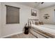 Well-lit bedroom showcases a decorative headboard and calm atmosphere at 150 S Osceola St, Denver, CO 80219