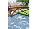 Spacious blue deck and green grass, with a wood fence in the background at 150 S Osceola St, Denver, CO 80219