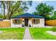 Charming single-story home with a well-manicured lawn and inviting front porch at 150 S Osceola St, Denver, CO 80219
