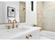 Modern bathroom featuring a white vanity, gold fixtures, and tiled shower at 2190 Vine Ave, Boulder, CO 80304