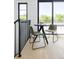 Eat in breakfast nook features a small black table and two gray cushioned chairs with a view at 2190 Vine Ave, Boulder, CO 80304