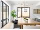 Modern dining room featuring a contemporary chandelier, large windows, and sleek decor at 2190 Vine Ave, Boulder, CO 80304